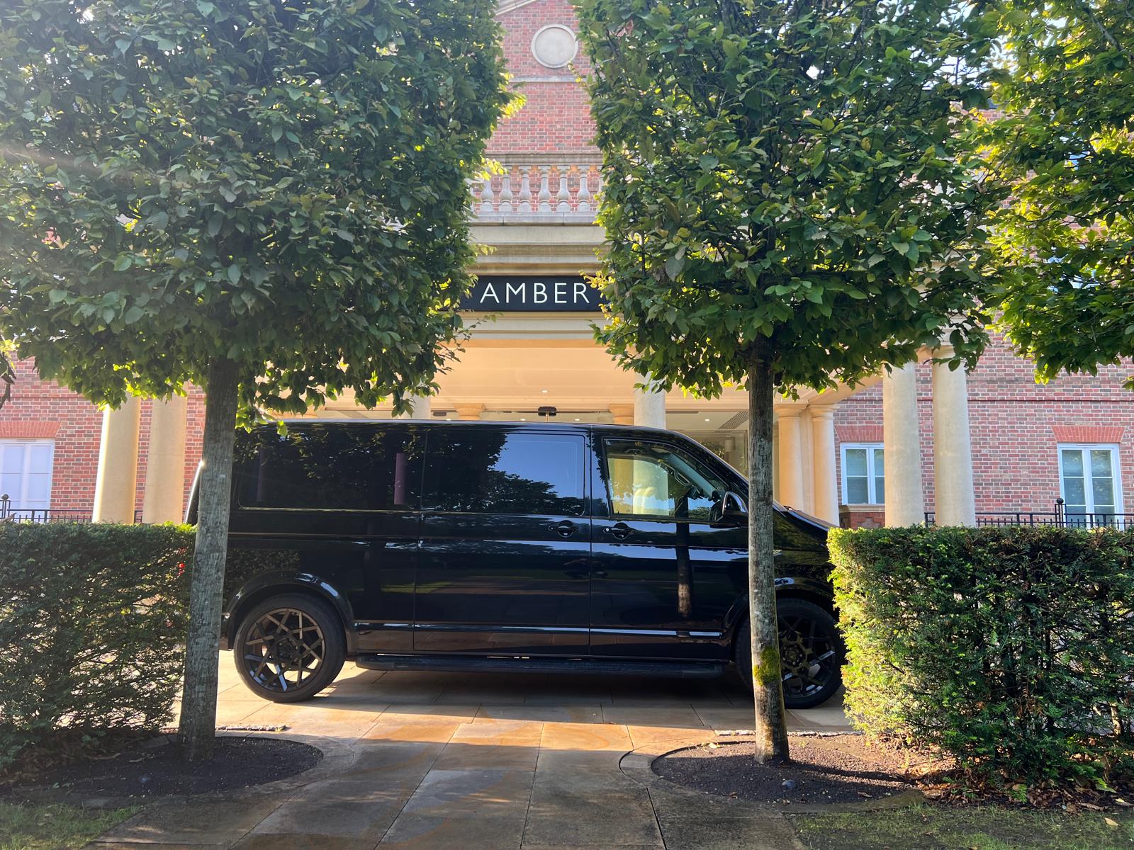 DJ London Tours van at hotel entrance for guest collection